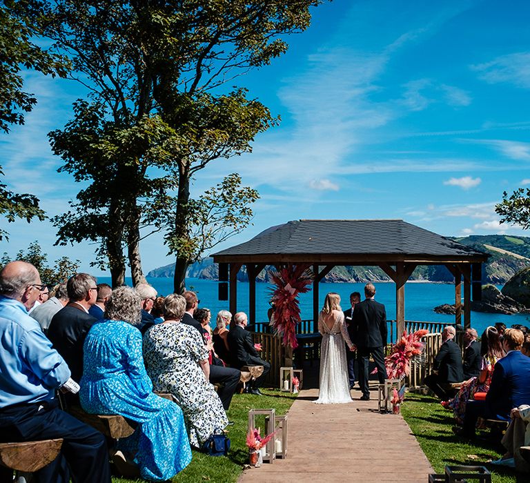 The bride and groom at their Watermouth Cove wedding venue in Devon