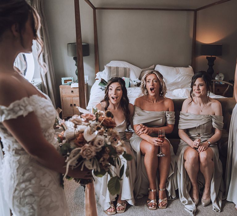 Bridal party in neutral green bridesmaid dresses for romantic rustic wedding 