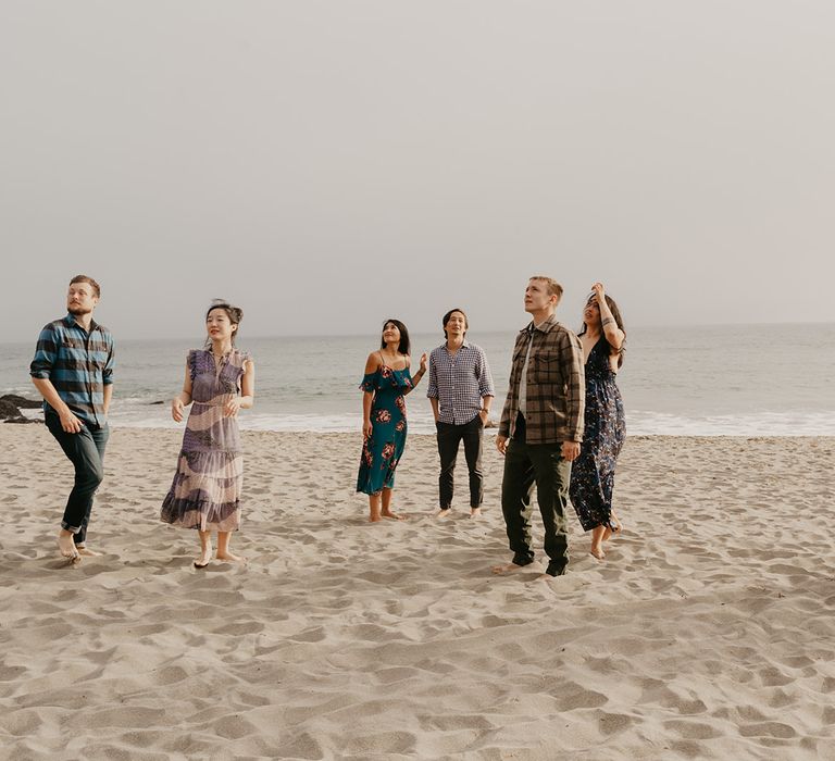 Wedding guests at intimate beach wedding 