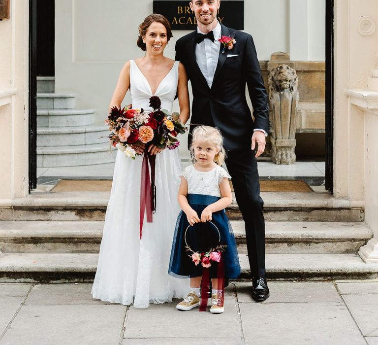 Bride anf groom with flower girl at Carlton House Terrace wedding