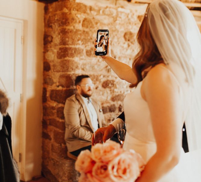 Devonshire Wedding Day Photography with bride taking a selfie