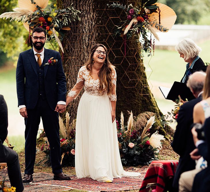 Bride and groom at ceremony with Moroccan themed wedding decor