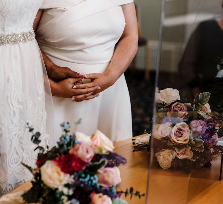 Lace wedding dress with pink rose wedding bouquet 