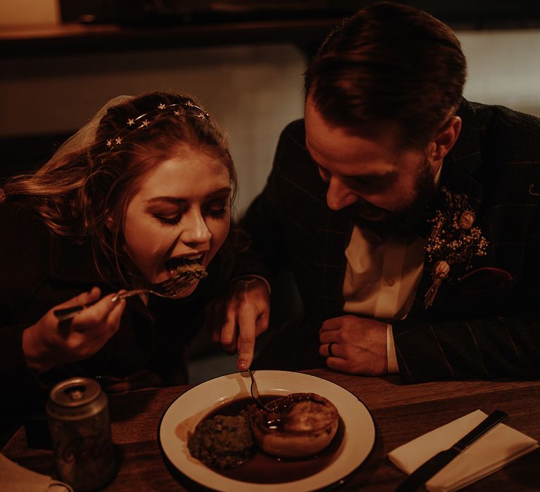 Bride and groom enjoy a pie at the elopement