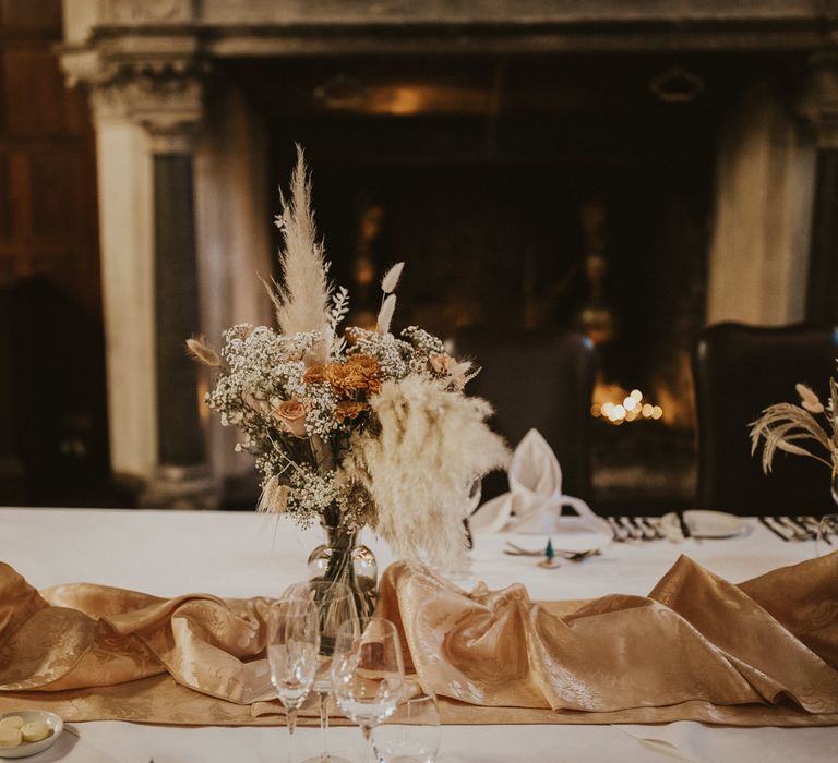 Dried and fresh flower centrepiece in neutral and peach tones 