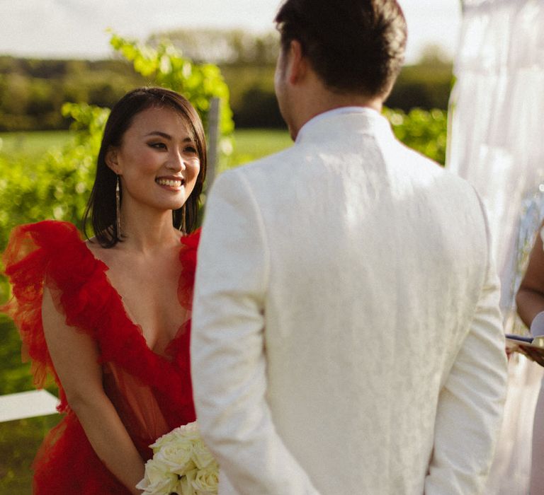 An intimate red, white and silver contemporary ceremony