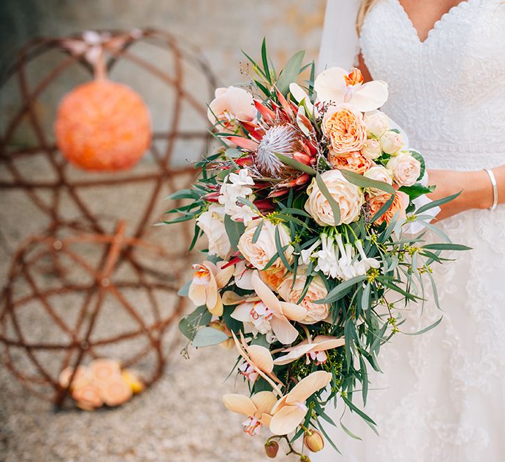 Peach wedding bouquet with pink and peach roses