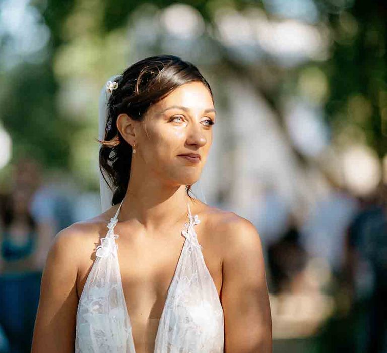 Beautiful bride in plunging gown 