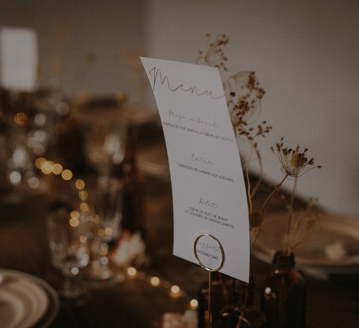 Menu card on minimalist wedding reception table 