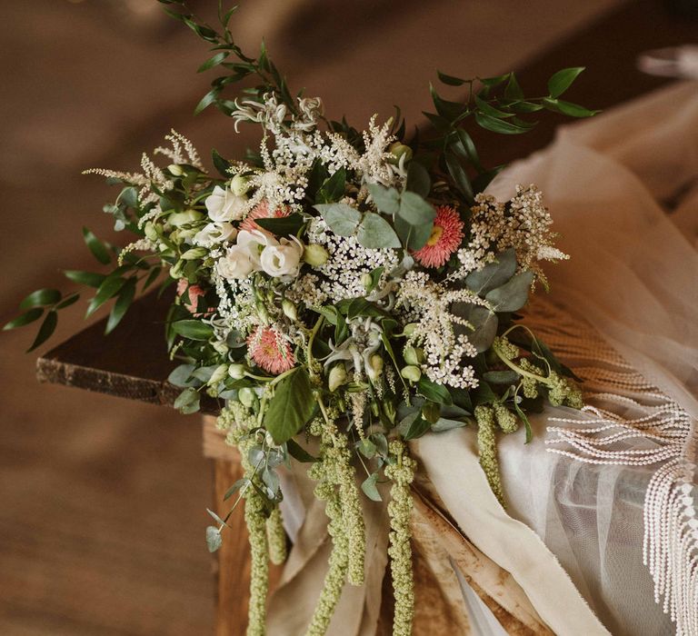 Bridal bouquet with whites and pinks tied with ribbon