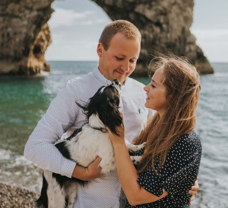 Couple engagement photography with their dog at the beach at durdle door 