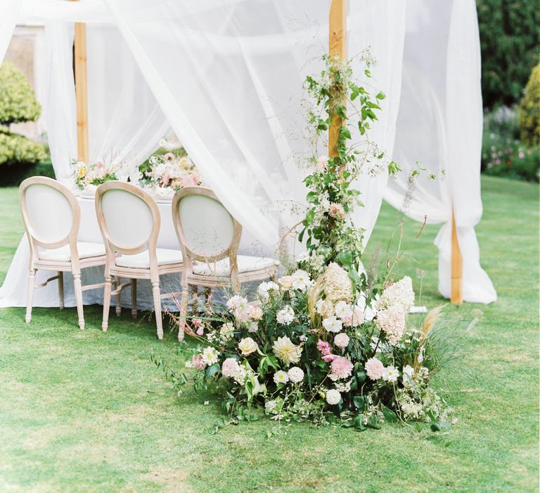 English garden party wedding with pergola wedding reception, cascading florals and white and pink colour palette