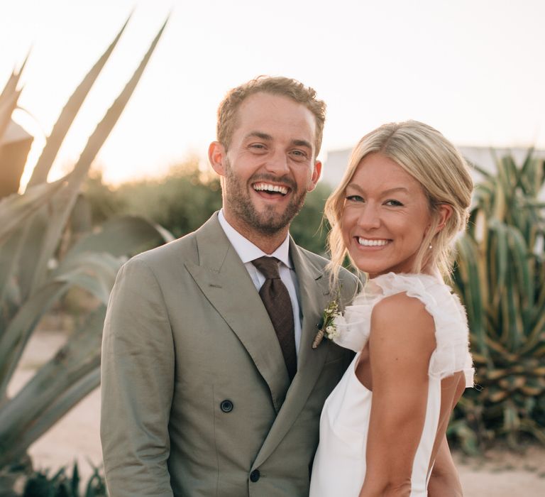 The happy couple smiling at their Masseria Potenti wedding