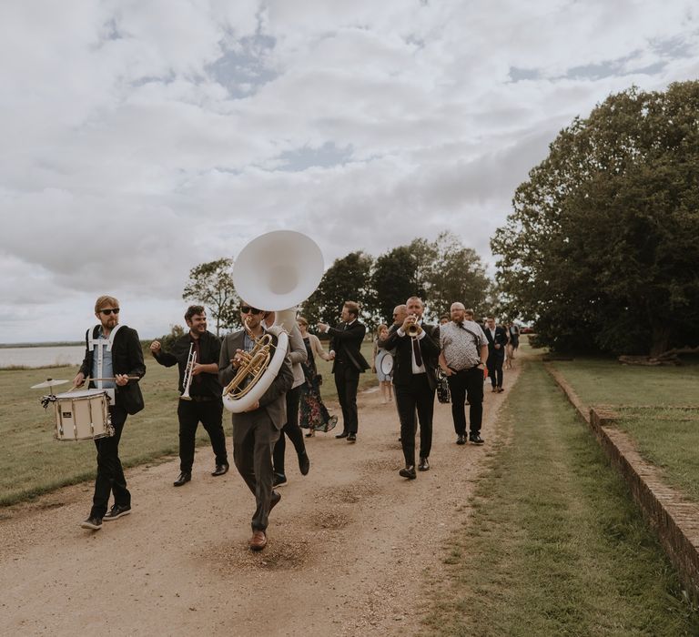 Marching brass band at Osea Island wedding 