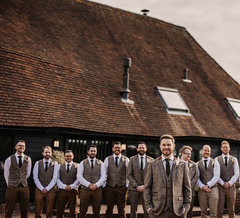 Groomsmen in matching tweed waistcoats