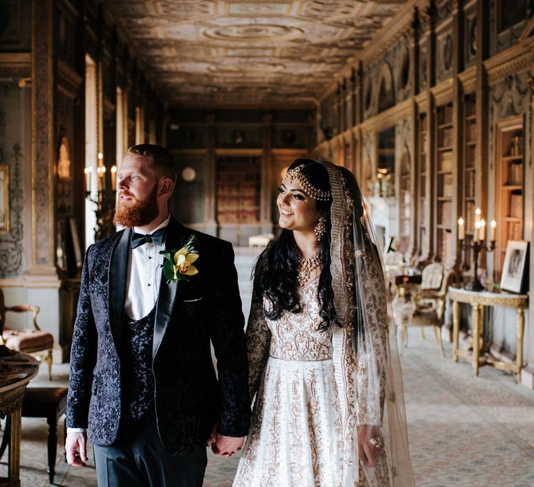 Multicultural wedding at Syon Park with Indian Bride in a gold dress and groom in a tuxedo 