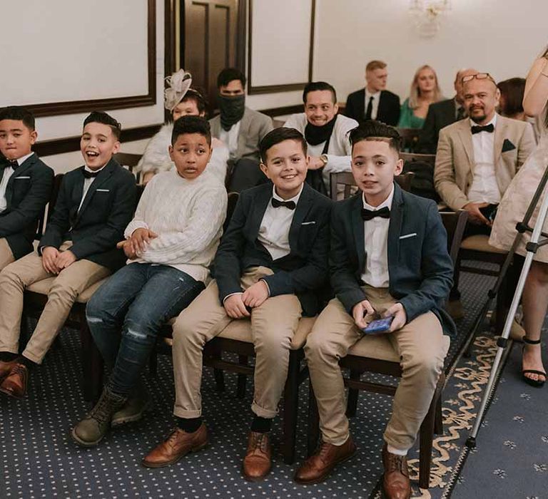 Group of family members at intimate wedding ceremony at Registry Office, Wotton House