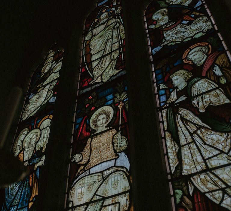 Large stain-glass windows at historic and timeless Hedsor House wedding