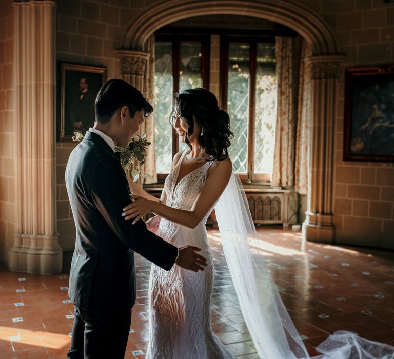 Bride & groom see each other for the first time on their wedding day during first look moment 