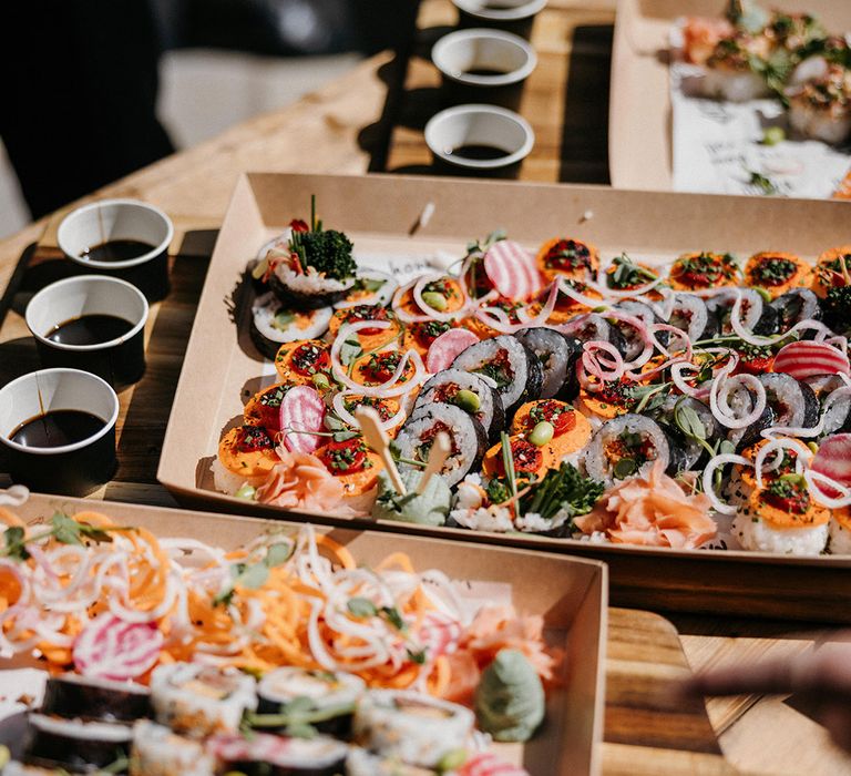 Sushi with pots of soy sauce for the wedding food