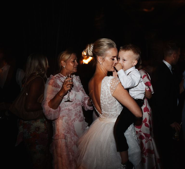 Bride dances with her son at reception 