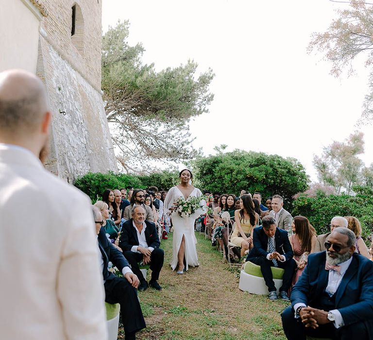 Groom watches Bride walk down the aisle at beautiful Torre de Bosis wedding venue in Portonovo, Italy