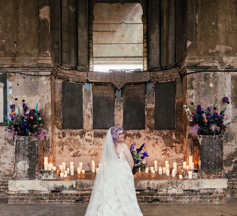 Bride in dainty leaf 3d appliqué sheer bridal gown and cathedral length veil at Asylum London Chapel wedding venue 