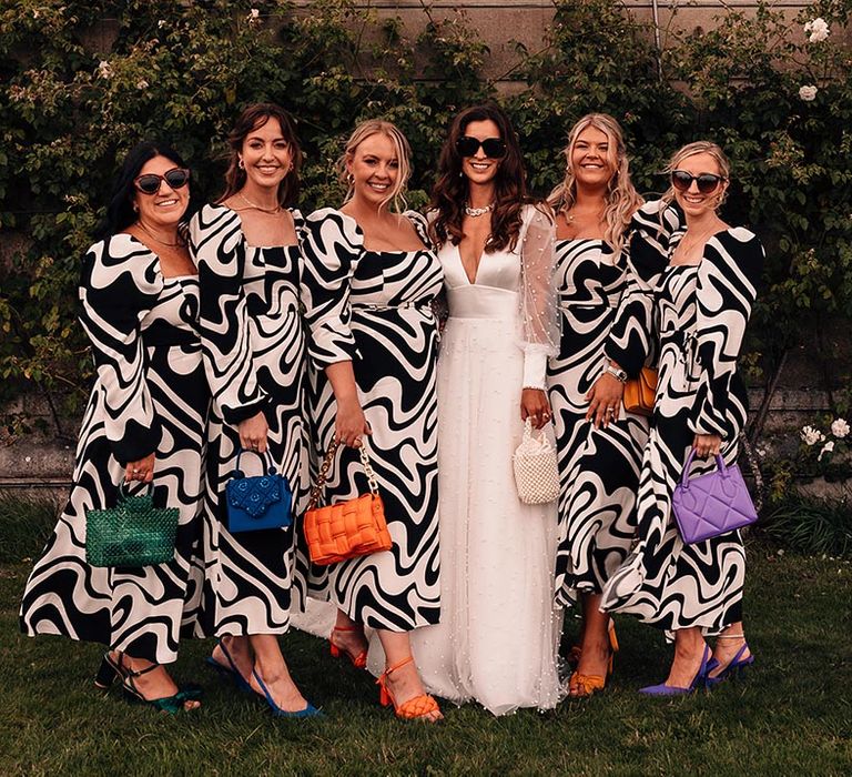 Square neck puff sleeve monochrome bridesmaid dresses from & Other Stories with colourful bags and shoes accessories with bride in Sassi Holford gown