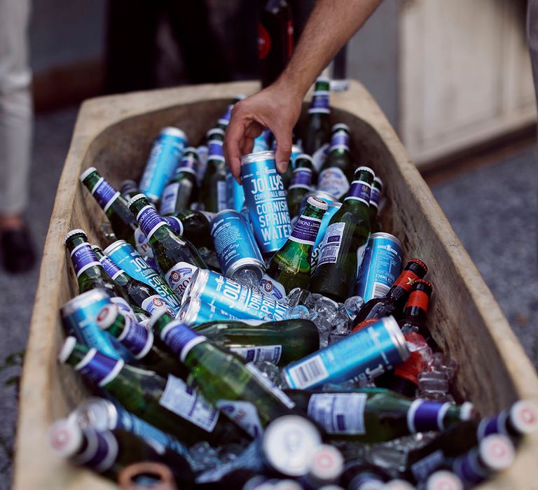 Tub full of beer and alcoholic wedding drinks for the wedding guests at the reception 