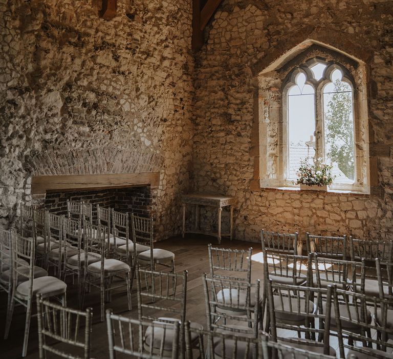 Rustic Pentney Abbey wedding venue with chairs set up for wedding ceremony 