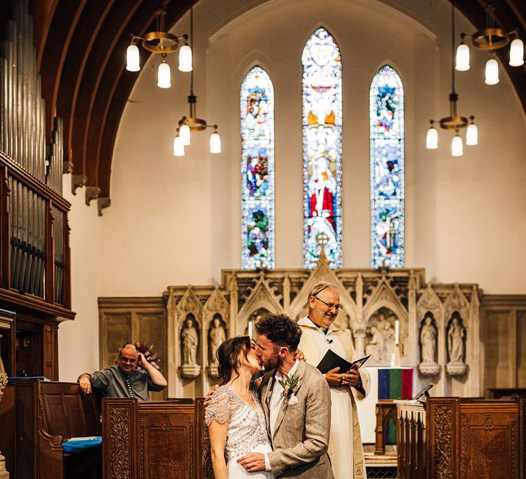 First kiss for the bride and groom as they are announced as a married couple 