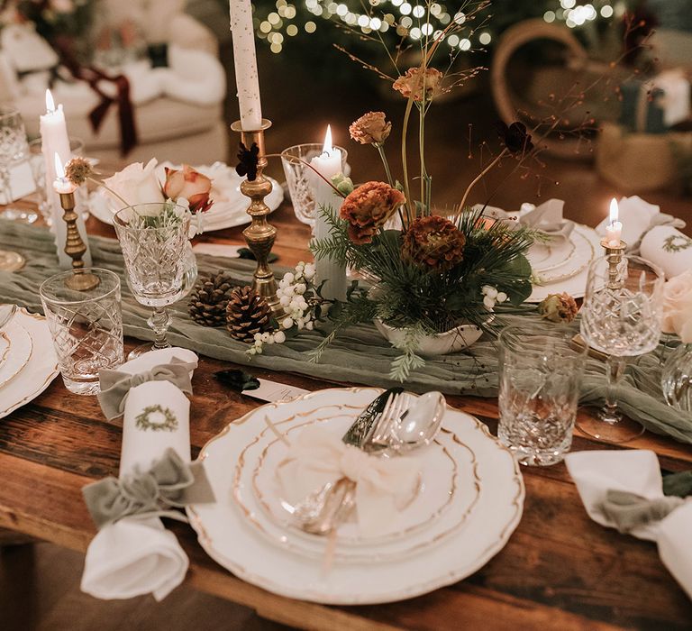 Green Christmas wedding theme tablescape with green decor and white and silver details 