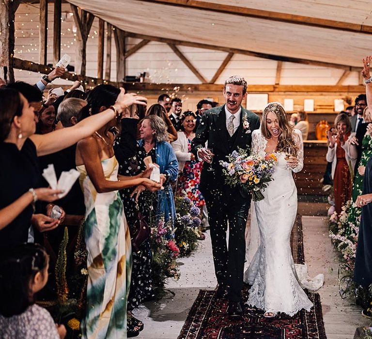 Confetti moment for the bride and groom at The Cherry Barn 