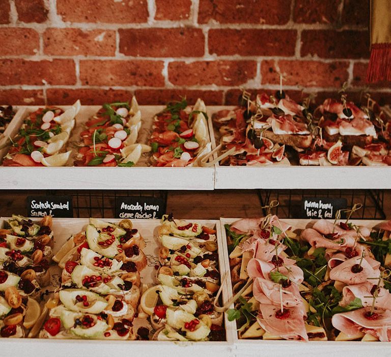 Wedding grazing table and charcuterie board with fruits, cheese and cured meats 