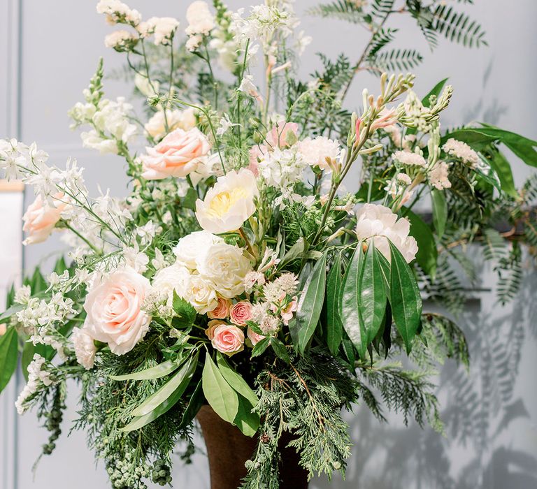 Light pink and white flowers with lots of foliage aisle flowers 