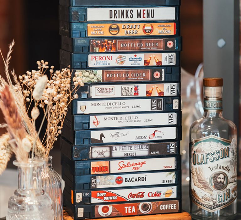 Unique wedding bar drinks menu sign made from old VHS tapes 