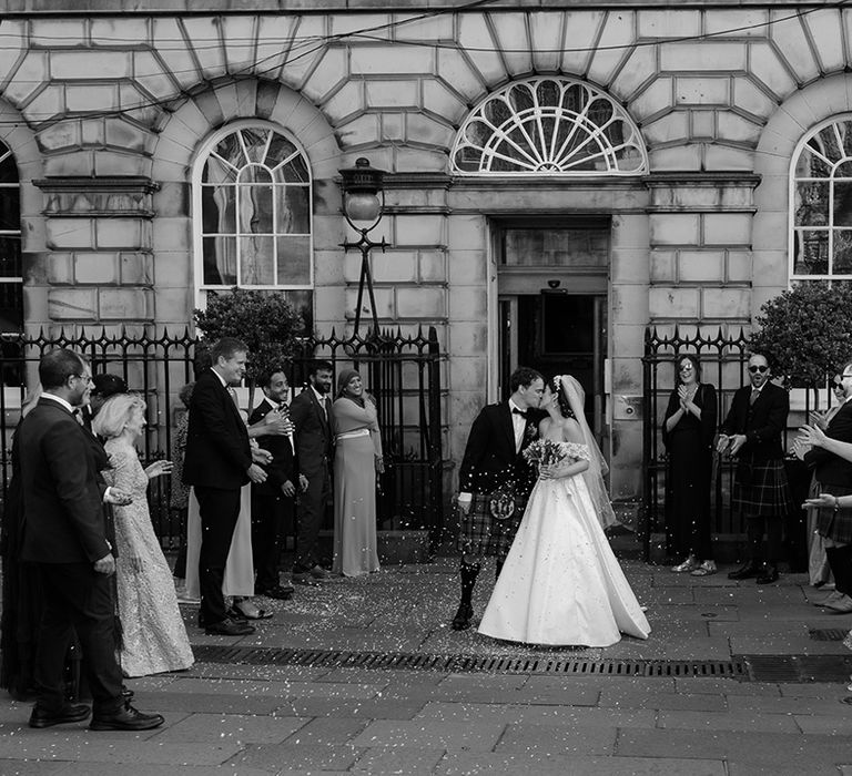 Confetti moment for the bride and groom at Signet Library wedding venue in Edinburgh 