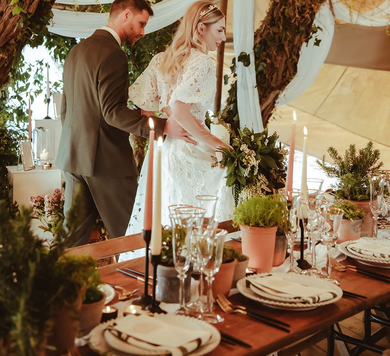 No waste wedding with beautiful botanical styling including foliage and white drapery for contemporary feel 