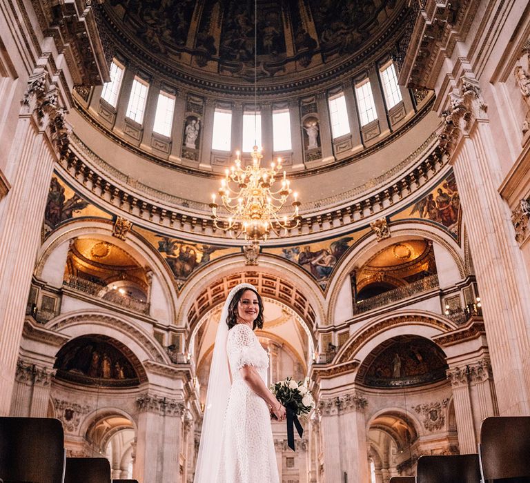 St. Paul's Cathedral wedding in London with bride in bespoke wedding dress and pearl crown 