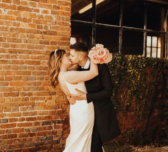 Couple kissing on their wedding day at stunning Devon wedding 