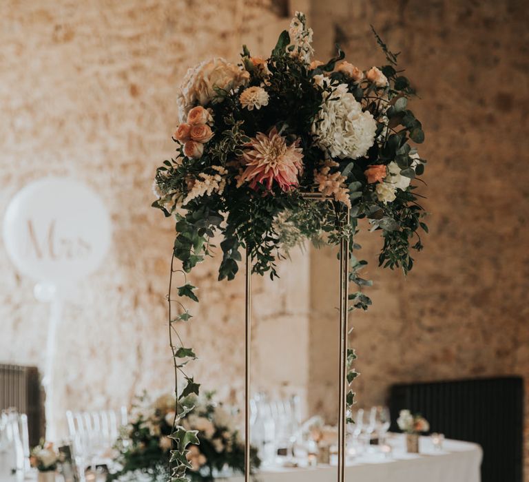 Tall floral centrepieces for Notley Abbey wedding 