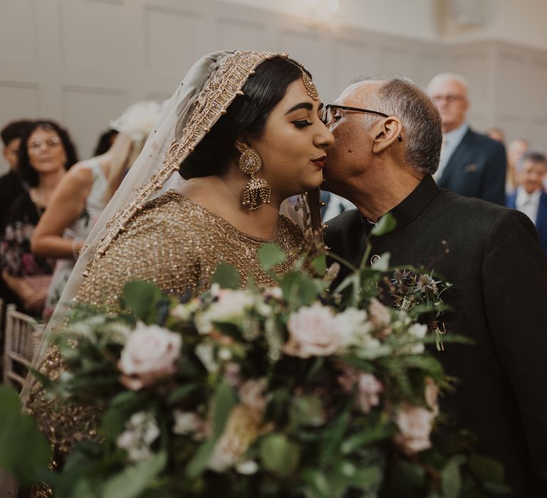 Father of the bride giving his daughter away at Nikah ceremony 