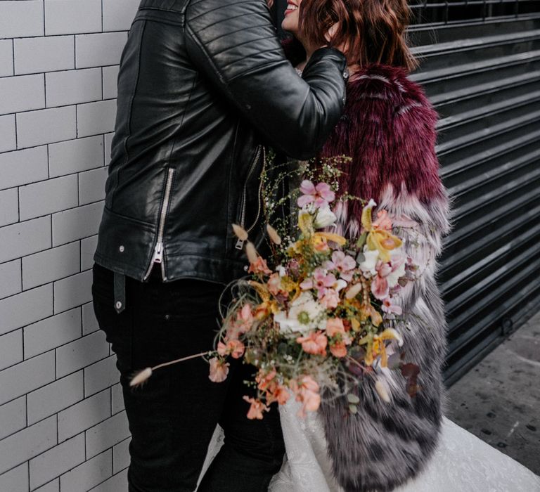 Bride & groom kissing on the streets of New York 