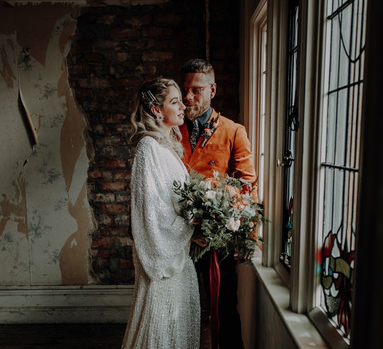 Couple portrait by stained glass windows