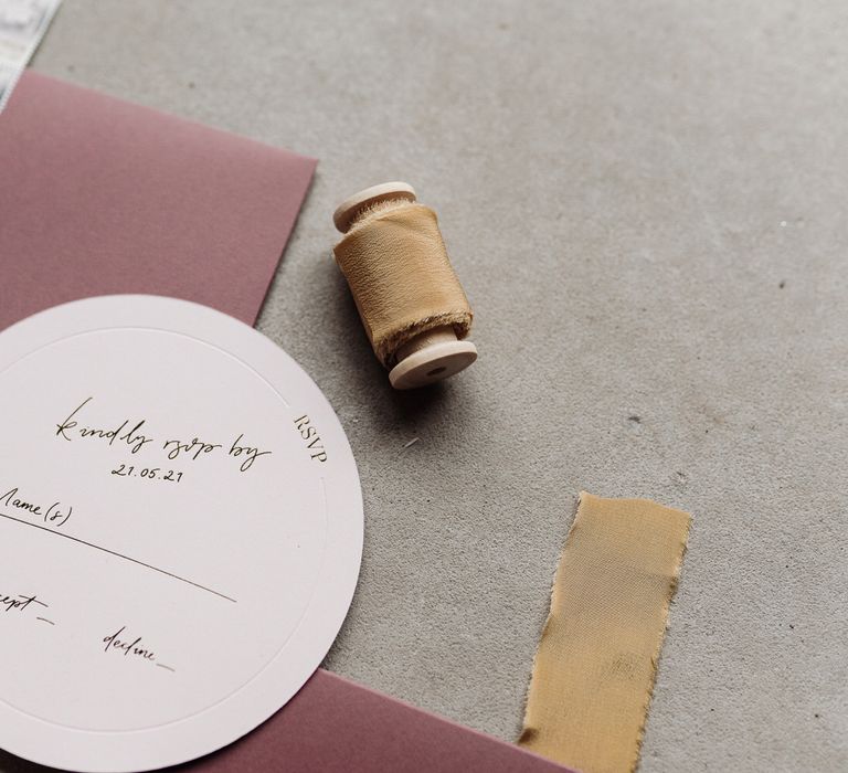 Gold ribbon details for the pink wedding stationery