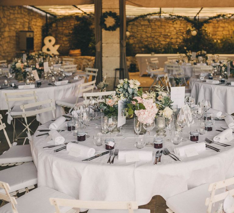 Classic white wedding seating at outdoor French wedding reception