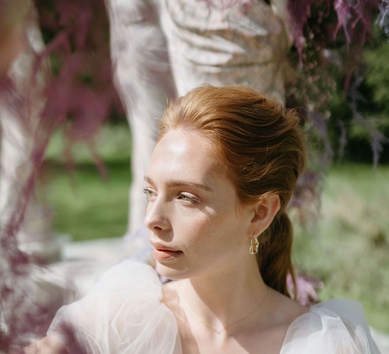 Ethereal bride looks into the sunlight 