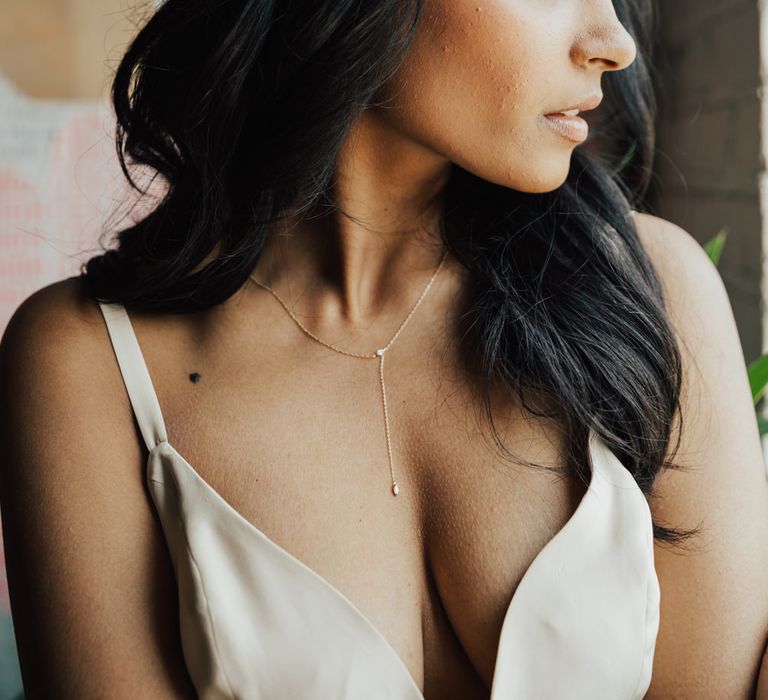 Bride wearing a delicate wedding necklace 