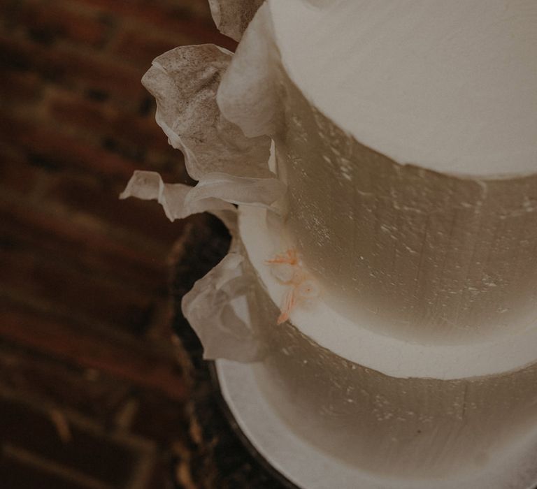 Buttercream wedding cake with ornate design 