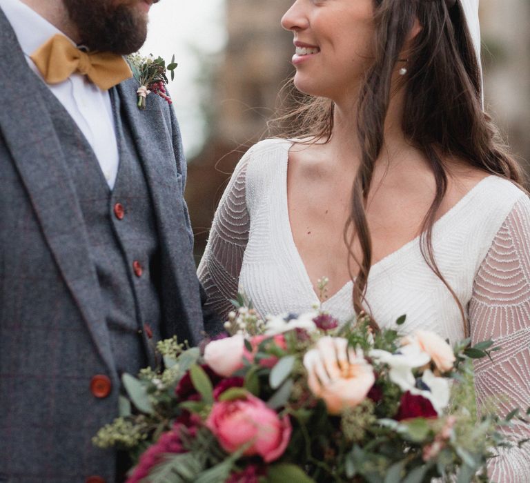 Bride and groom wedding day photography - bride wears beaded wedding gown